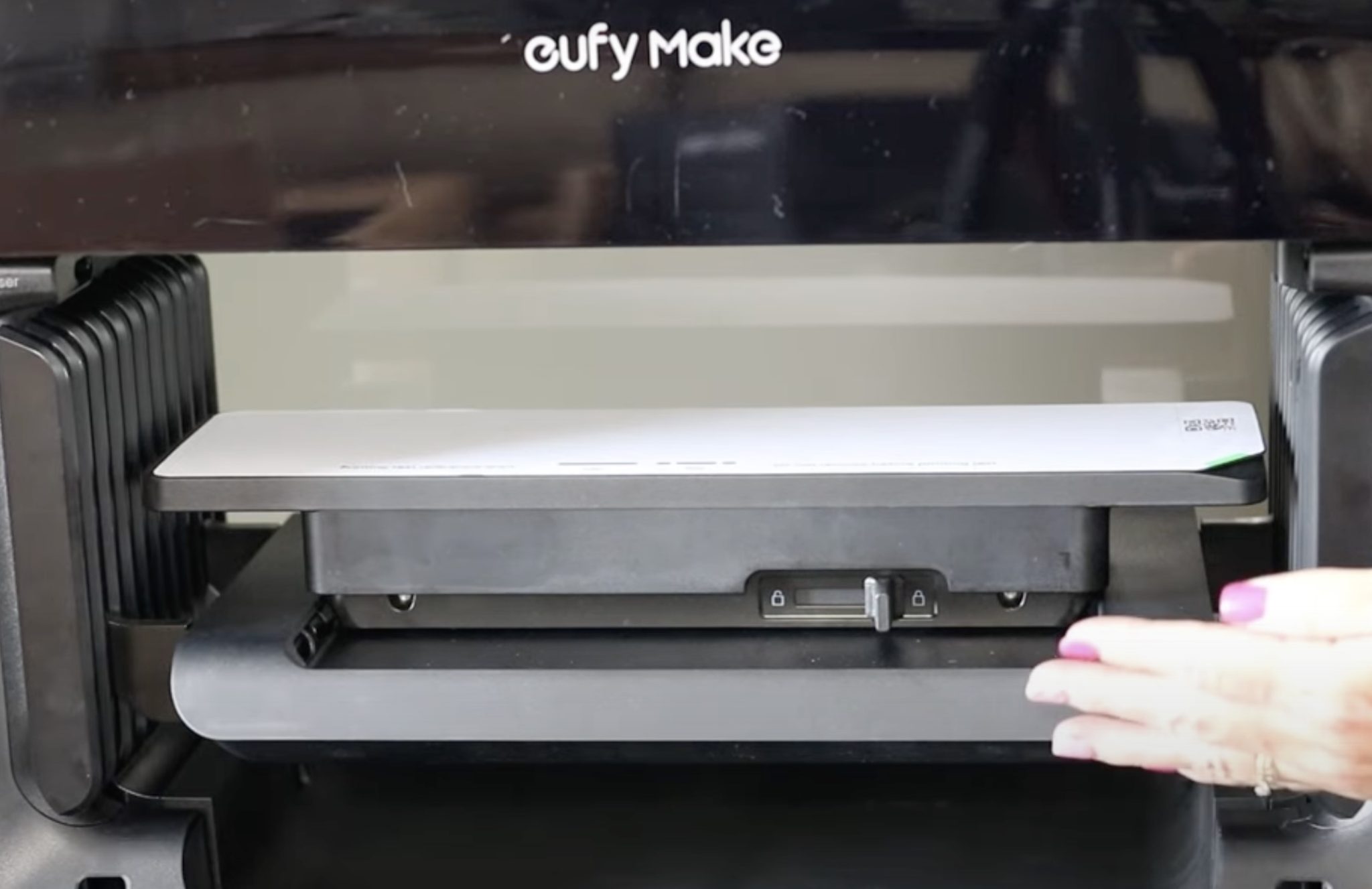 Mini flatbed in printer with print test sheet.